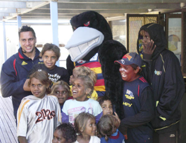 Andrew McLeod, Claude the Crow and they APY kids (Photo courtesy AFC)