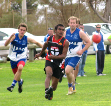 Fabian Kenny leads the pack in persuit of the ball