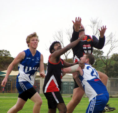 Timmy Walker with Kendall Plant going for the mark