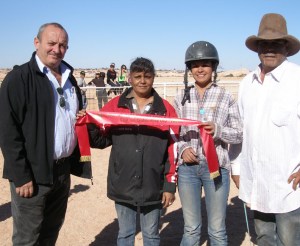 Robert Coro presents second place ribbons to “Taken Charge”, L-R Colleen Taylor, Jockey Gemma Hunt and Ronald Boland
