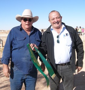 Robert Coro presents third place ribbon to Opal Inn manager Ken Williams for Snowby Boy