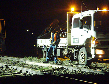 Workers cleared broken wood and debris from the line and assess damage to the rails