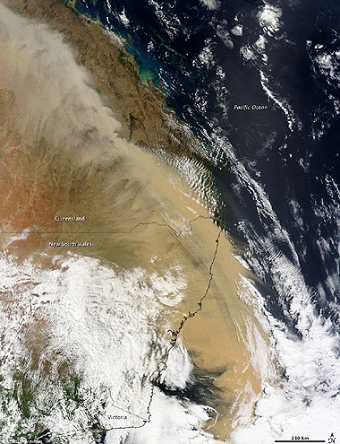Visible from space: A beige wall of dust can be seen stretching over Queensland and out to sea.  Nasa photo 24-9-2009
