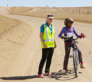 On the road along the Dog Fence are Joy Griffiths and Patricia Brown cyclist