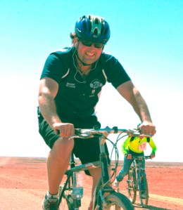 Luke Kenny looking very cheery was the First Cyclist in