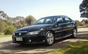 Black 2004 VZ Holden Commodore sedan with the SA registration number XLS408 missing from the property.